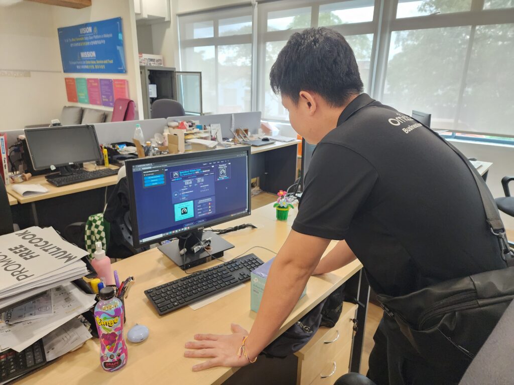Office PC undergoing internet connectivity check by technician